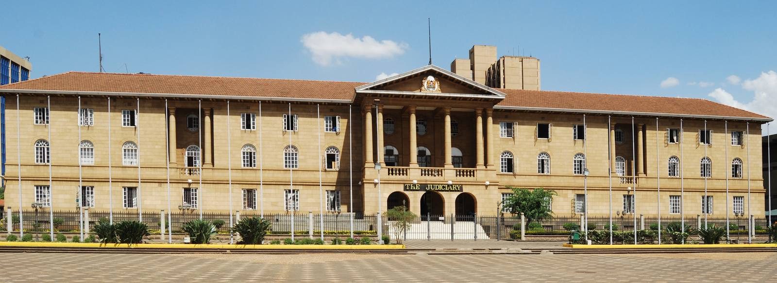 The Judiciary, Nairobi — Wing, CC BY-SA 3.0, Wikimedia Commons The Judiciary, High Court of Kenya, Nairobi